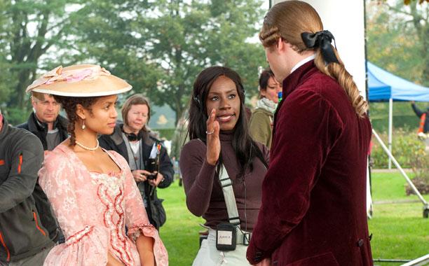 Gugu Mbatha-Raw with director Amma Asante on the set of Belle (2014)